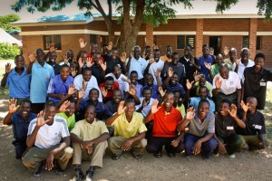 Bible school pastor students wearing new shirts donated from Canada.