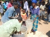 grandmother-and-child-receiving-food-at-iris-africas-feeding-program