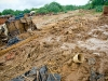 a-piece-of-the-front-fence-a-bucket-and-some-clothes-is-all-that-remains-for-this-family