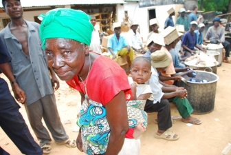 q-grandmother-and-child-getting-food-assistance-at-iris-africa