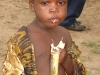 child-eats-sugar-cane